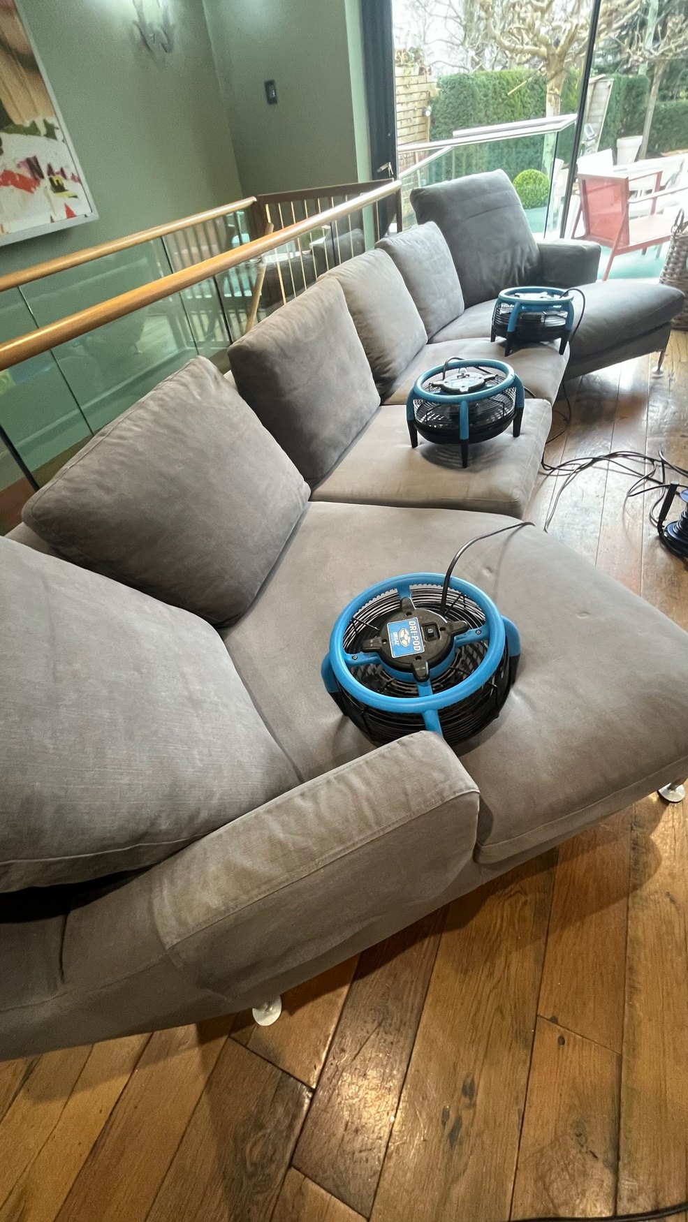 FamilySafe Carpet Cleaning — professional sofa cleaning with drying equipment in a luxury home