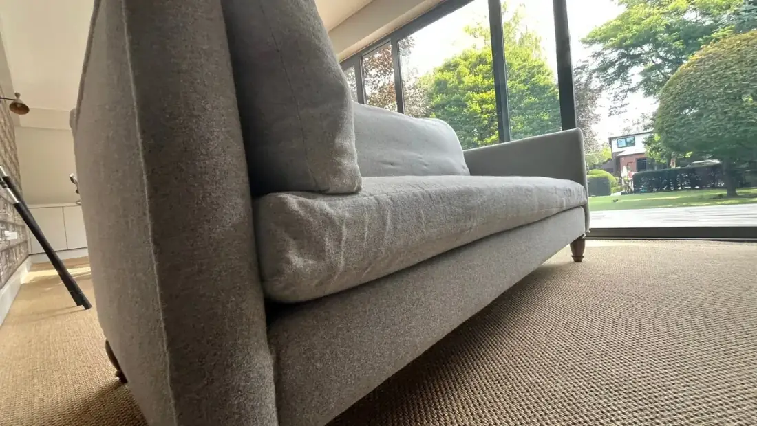 Luxury fabric sofa being professionally cleaned